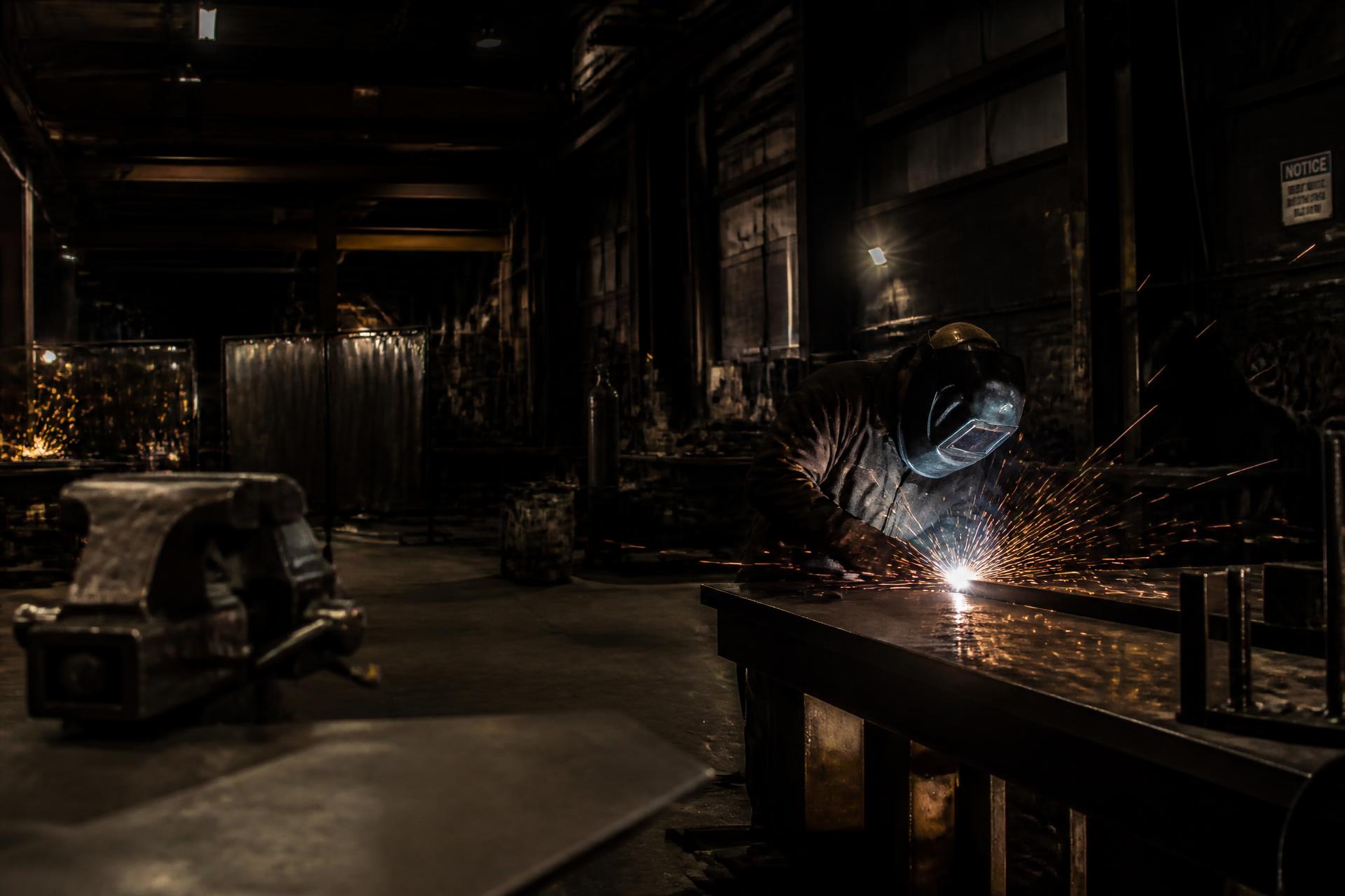 Welder fabricating steel in the Alexandrou Custom Works workshop